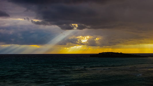 body of water under cloudy sky during sunrise thumbnail