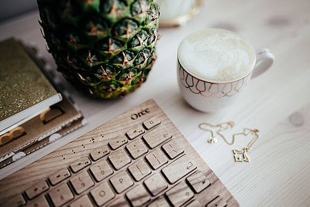 Wooden keyboard and cup of coffee thumbnail