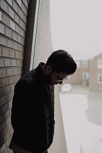 man standing and looking down thumbnail