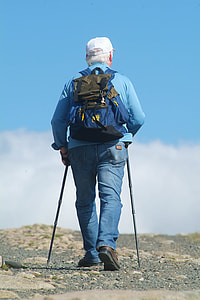 man wearing blue long sleeve black and using two  steel canes thumbnail