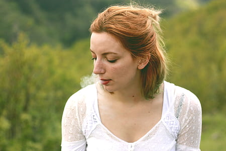woman wearing white V-neck top thumbnail
