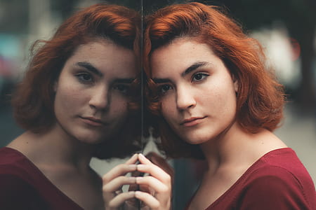 woman leaning on mirror close up photo thumbnail