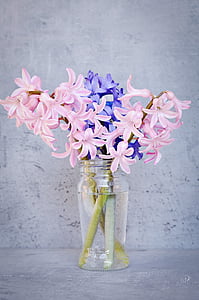 pink and blue flowers in glass vase thumbnail