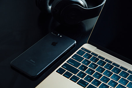 Laptop, mobile smart iphone on desk thumbnail