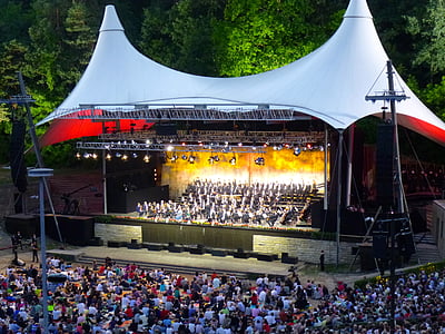 people on stage at night thumbnail
