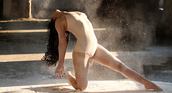 woman wearing brown leotard dancing thumbnail