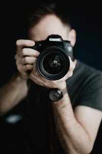 Young man taking photos thumbnail