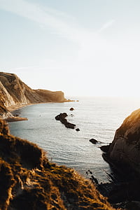 rock formation near ocean thumbnail