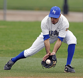man catching baseball ball during daytime thumbnail