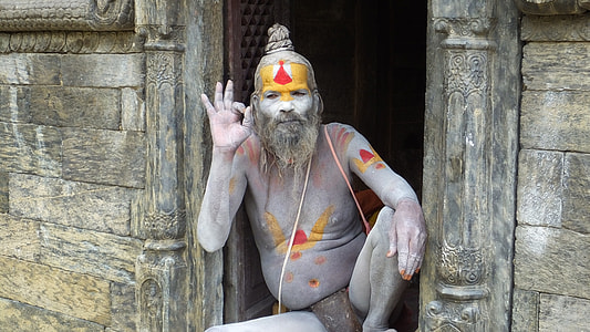 man with face paint sitting on floor thumbnail