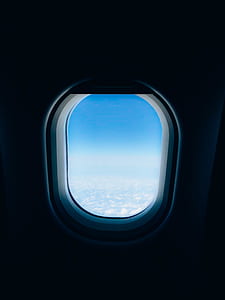 selective focus photography of airplane window thumbnail