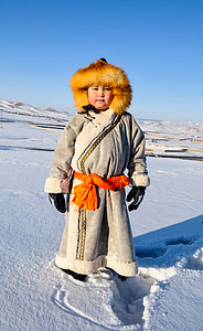 photo of boy standing on snowfield thumbnail