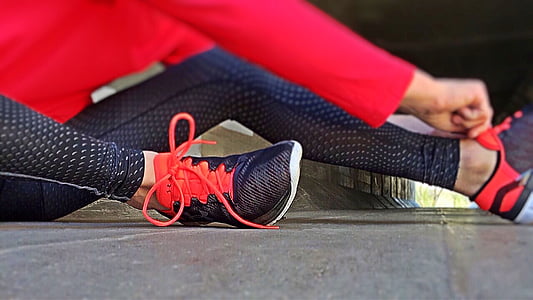 person wearing lace-up shoes and leggings thumbnail