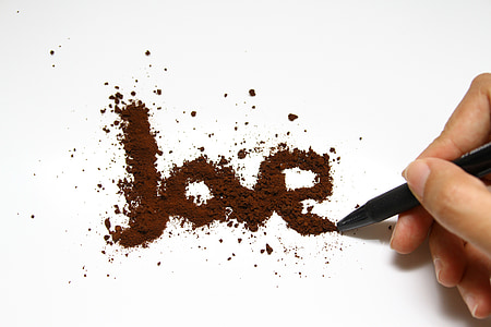 person writing love on paper thumbnail