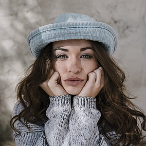 photo of woman resting her head on hands thumbnail