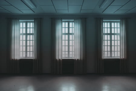 windows with white curtains inside empty room thumbnail