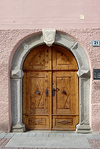 closed brown wooden doors thumbnail