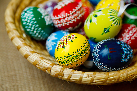 bundle of multicolored bath bombs on round brown wooden basket thumbnail