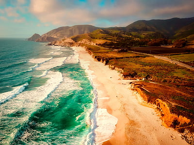 beach and sea waves during daytime thumbnail