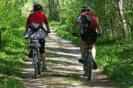 two person wearing red shirt biking during daytime thumbnail
