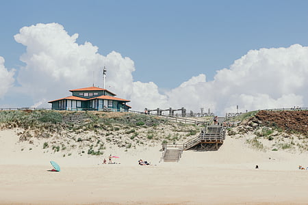 gray house near seashore thumbnail