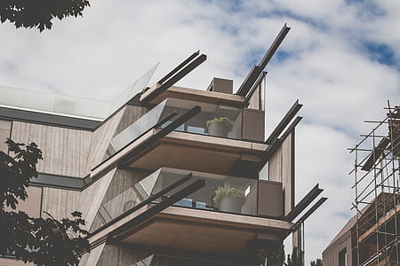 low-angle photography of white and black concrete building thumbnail