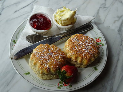 baked pastry with strawberry jam served on white plate thumbnail