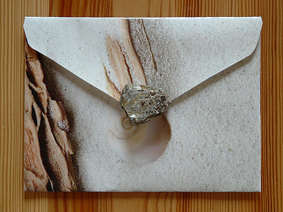 gray and brown envelop bag on brown wooden surface thumbnail