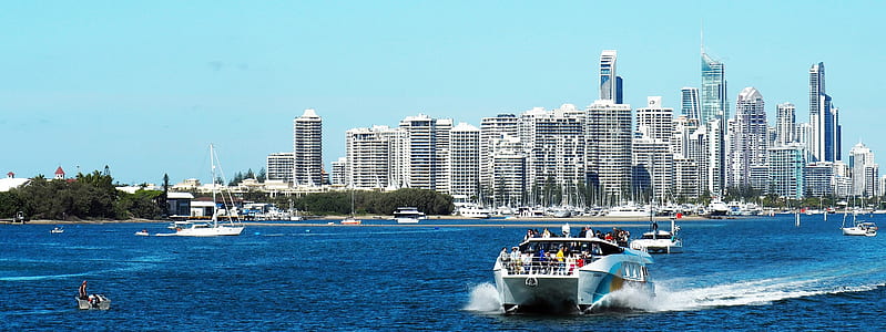 powerboat near buildings thumbnail