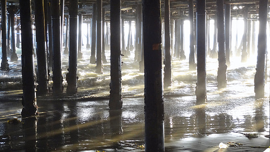 minimalist photography of building columns on beach thumbnail