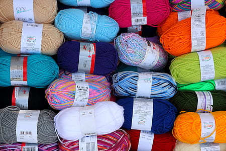 pile of assorted-color yarn roll thumbnail