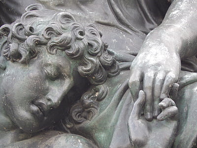 statue of person holding hands thumbnail
