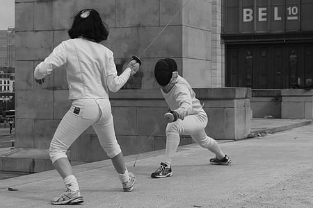 two person using sword near building thumbnail