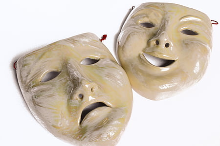 beige happy and sad masks on white surface thumbnail