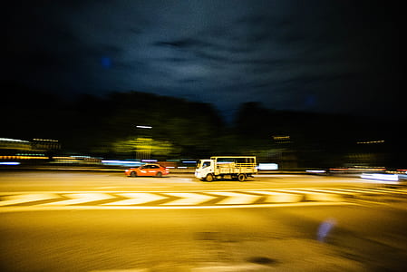 vehicles on road during nighttime thumbnail