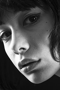 grey scale photo of woman's face thumbnail