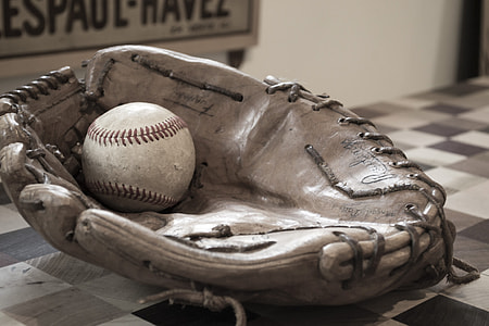 baseball mitt and baseball game ball thumbnail
