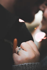 woman kissing with man while holding on chest thumbnail