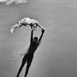 grayscale photography of person diving on water thumbnail