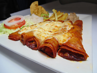 rolled food with vegetables on plate thumbnail