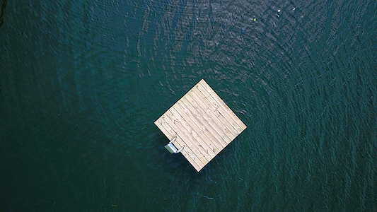 bird's eye photography of brown wooden floating platform thumbnail