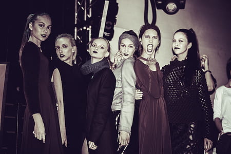 six woman standing near white wall thumbnail