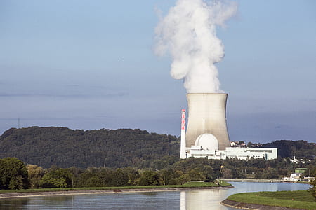 smoke coming out from power plant near trees during daytime thumbnail