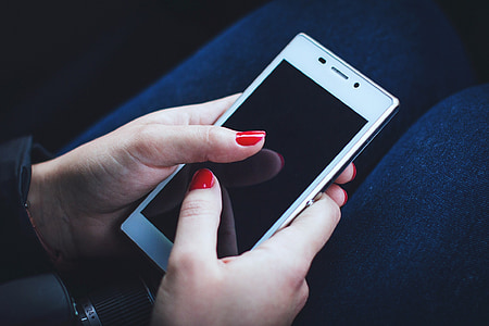 person holding white smartphone thumbnail