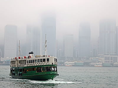 green and white cruise ship on body of water thumbnail