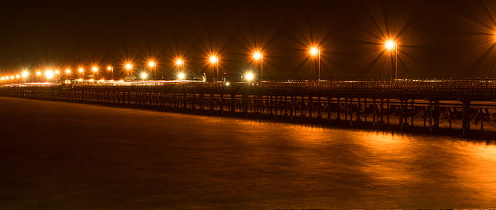 lighted post lamp lot during nighttime thumbnail