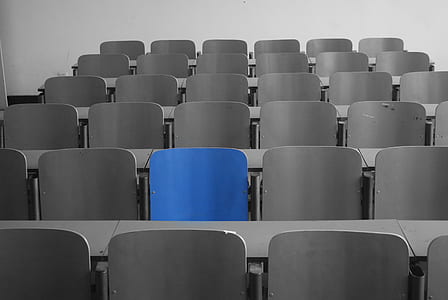 selective focus photography of blue metal chair thumbnail