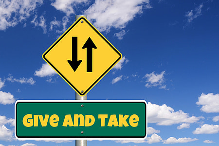 yellow and green Give and Take street signage thumbnail