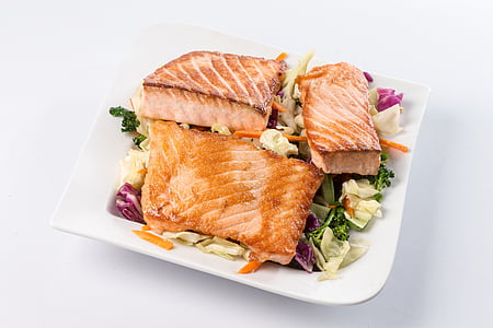 cooked fish slices on top of salad thumbnail