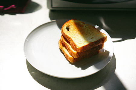 pile of toasted bread on ceramic plate thumbnail